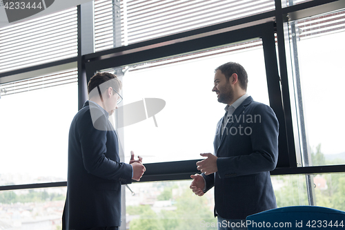 Image of cloasing the deal in modern office interior