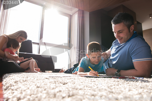 Image of young couple spending time with kids