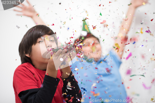 Image of kids  blowing confetti