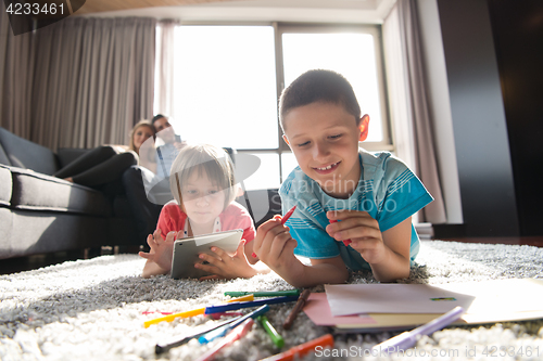 Image of young couple spending time with kids