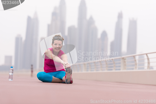 Image of woman stretching and warming up