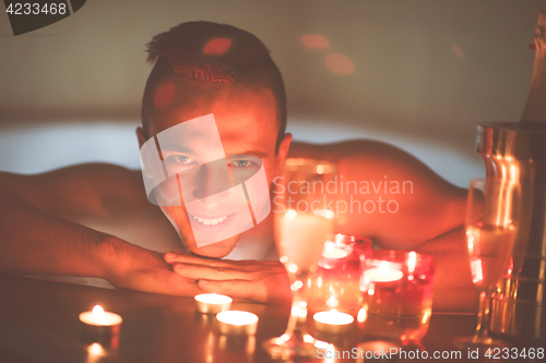 Image of man relaxing in the jacuzzi