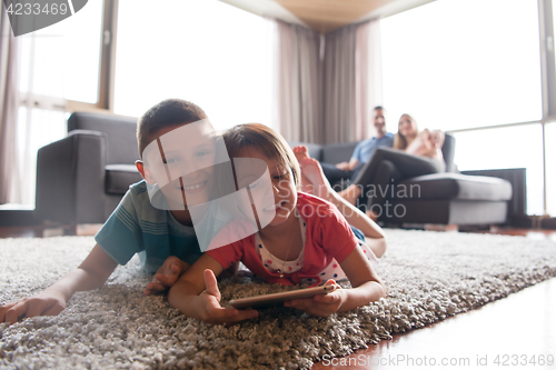 Image of couple spending time with kids