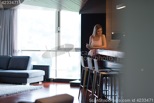 Image of woman eating breakfast enjoying relaxing lifestyle
