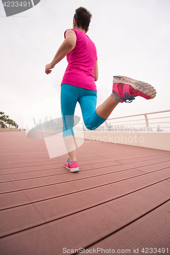 Image of woman busy running on the promenade