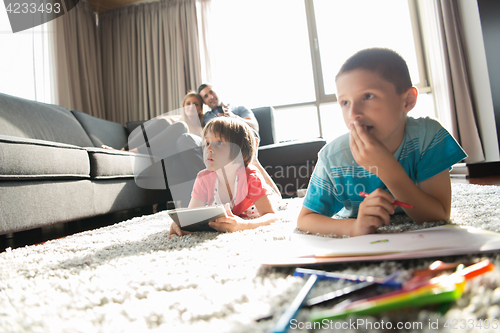 Image of young couple spending time with kids