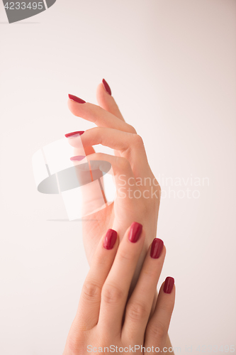 Image of closeup of hands of a young woman