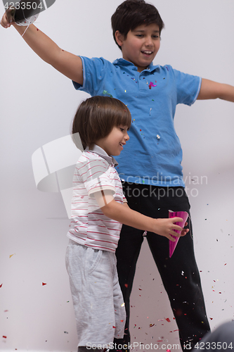 Image of kids  blowing confetti