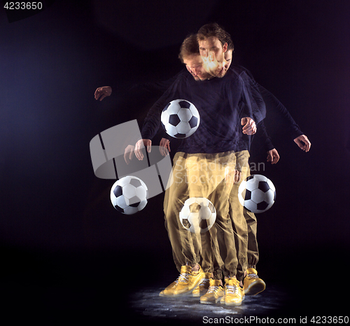 Image of A portrait of a fan with ball on gray studio background. Freestile