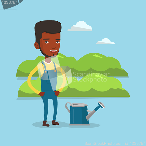 Image of Farmer with watering can at field.