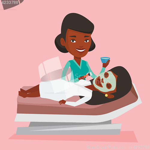 Image of Woman in beauty salon during cosmetology procedure