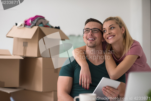 Image of Young couple moving in a new home