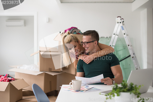 Image of Young couple moving in a new home