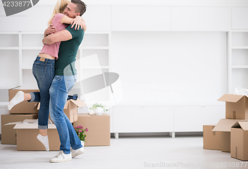 Image of happy Young couple moving in new house