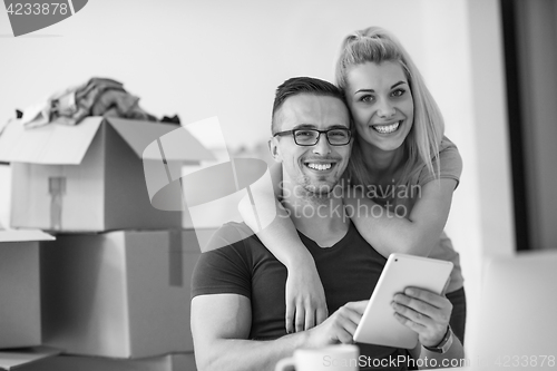 Image of Young couple moving in a new home