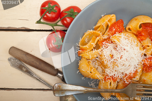 Image of Italian snail lumaconi pasta with tomatoes