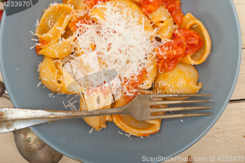 Image of Italian snail lumaconi pasta with tomatoes