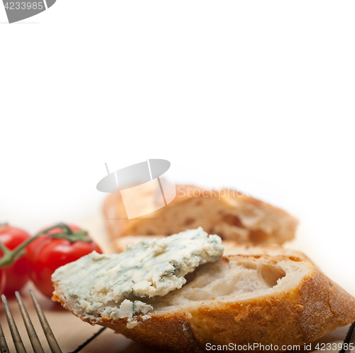 Image of fresh blue cheese spread ove french baguette