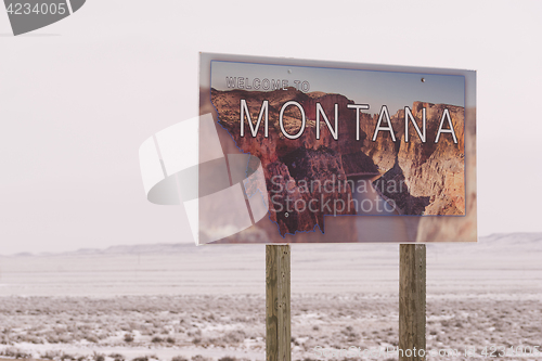Image of Welcome to Montana Winter State Boundary Highway Sign
