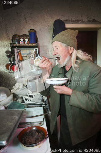 Image of Old man tasting food