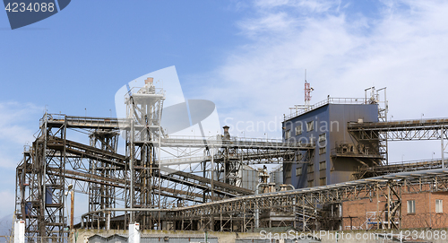 Image of Pipes oil refining factory against a blue sky