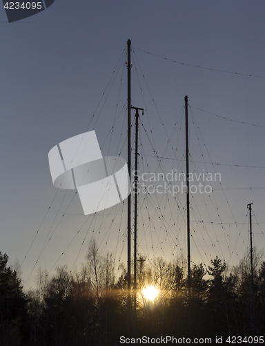 Image of Silhouette Antenna against the sky at sunrise