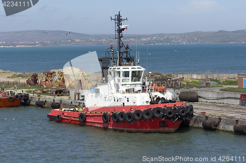 Image of Orange rescue or coast guard patrol boat in blue sea water