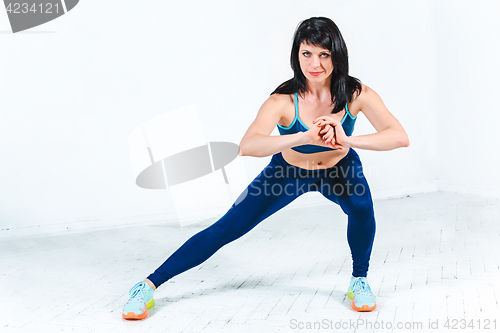 Image of The woman training in a gym of a fitness center