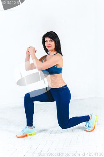 Image of The woman training in a gym of a fitness center