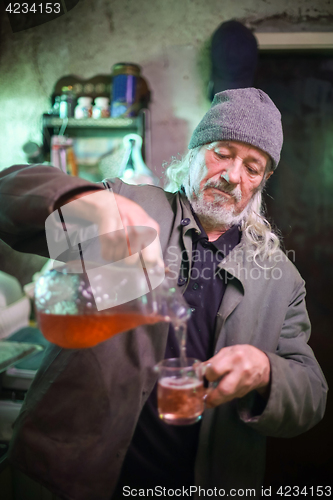 Image of Man pouring wine