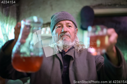 Image of Man holding pitcher