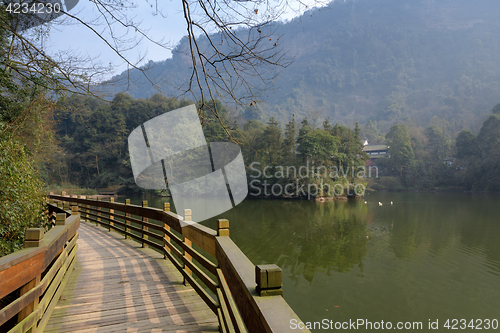 Image of Large lake between mountains under sky