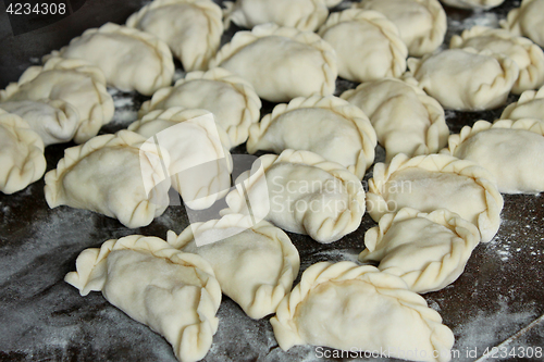 Image of Dumplings on the dark kitchen board