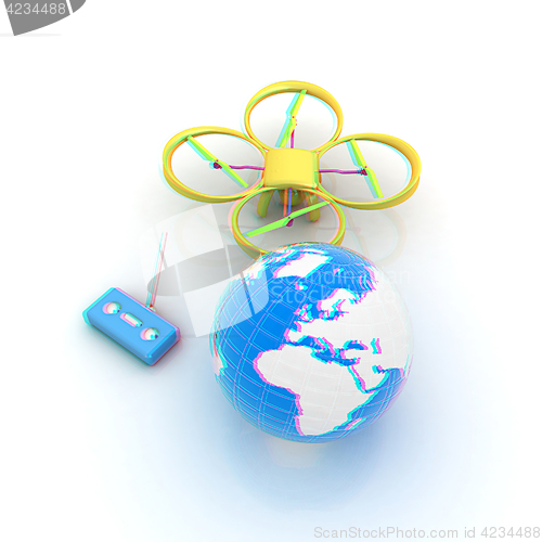 Image of Quadrocopter Drone with Earth Globe and remote controller on a w