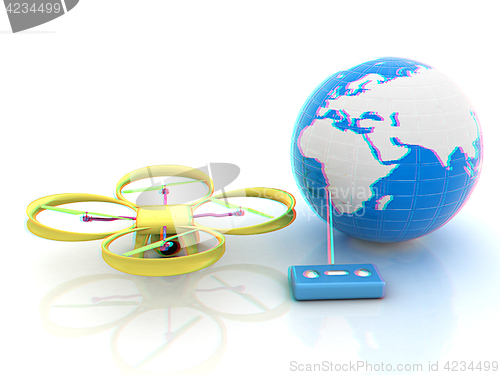 Image of Quadrocopter Drone with Earth Globe and remote controller on a w