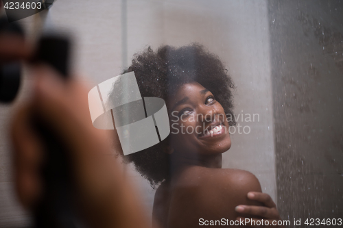 Image of African American woman in the shower