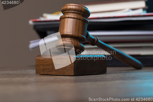 Image of Hammer of judge against folder