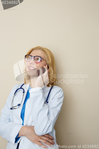 Image of Young woman talking on phone