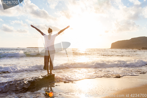 Image of Free Happy Woman Enjoying Sunset on Sandy Beach