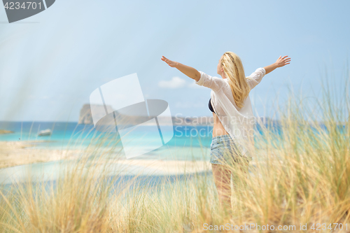 Image of Free Happy Woman Enjoying Sun on Vacations.