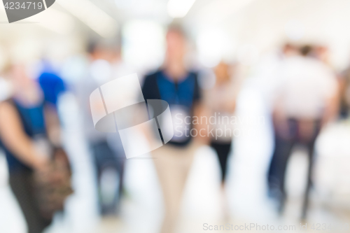 Image of Abstract blurred people socializing during coffee break at business conference.