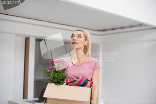 Image of girl moving in the new apartment