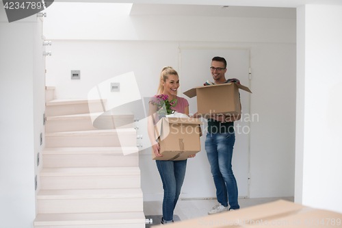 Image of young couple moving into a new home