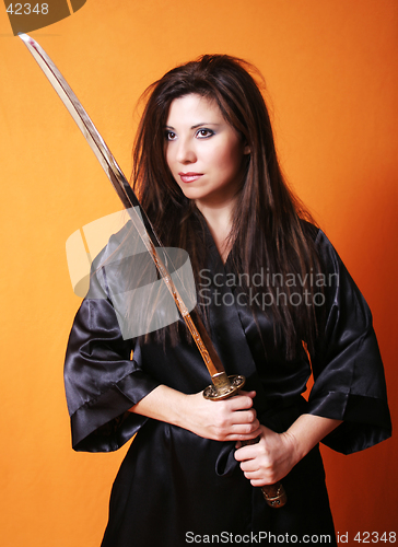 Image of Dual Female holding a sword