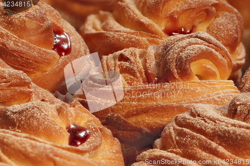 Image of cruffins with jam background