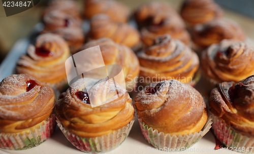 Image of  Muffins fresh pastry on baking sheet