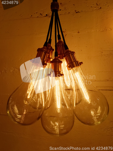 Image of Bunch of light bulbs on concrete background