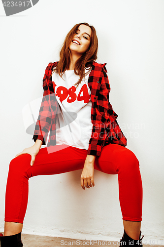 Image of young pretty teenage hipster girl posing emotional happy smiling on white background, lifestyle people concept