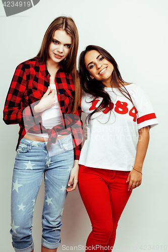 Image of best friends teenage girls together having fun, posing emotional on white background, besties happy smiling, lifestyle people concept, blond and brunette multi nations 