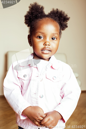 Image of little cute african american girl playing with animal toys at home, pretty adorable princess in interior happy smiling, lifestyle people concept